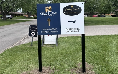 Apartment signs and wayfinding for Grace Lane Apartments with post-mounted directional signs directing residents and visitors to the leasing office and Eading Court