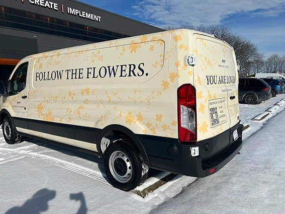 Full wrap on a Ford Transit van for French Florist featuring a cream background with gold floral graphics and the tagline Follow the Flowers, designed and installed by Eye 4 Group in Indianapolis