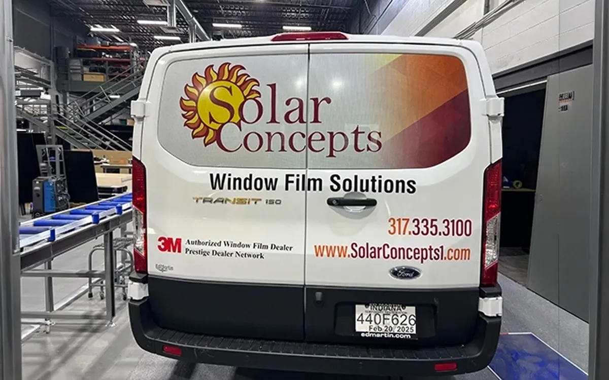 Full color vehicle wrap on Ford Transit van for Solar Concepts Window Film Solutions in Indianapolis Indiana showing logo branding and contact information