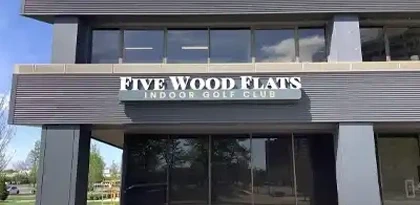 Five Wood Flats Indoor Golf Club dimensional channel letter building identification sign mounted on a modern exterior facade in Indianapolis, installed by Eye 4 Group